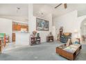 Spacious living room featuring vaulted ceilings, a ceiling fan, and an open floor plan at 14325 Golden View Dr, Grand Island, FL 32735