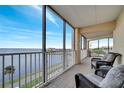 Relaxing waterfront balcony featuring seating and breathtaking views at 225 W Seminole Blvd # 409, Sanford, FL 32771