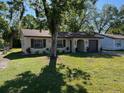 Nice single-story home with a well-kept lawn, a paved driveway, and an attached garage at 2617 S Marshall Ave, Sanford, FL 32773
