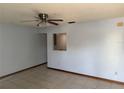 Living room with tile flooring, ceiling fan, and a neutral color palette, offering a bright and airy feel at 2618 Adela Ave, Orlando, FL 32826