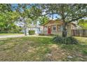 Well-kept home with mature trees, a manicured lawn, and great curb appeal at 712 Baffie Ave, Winter Park, FL 32789