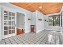 Inviting sunroom with tile floors, wood ceiling, and bright lighting, perfect for relaxing at 712 Baffie Ave, Winter Park, FL 32789