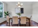 Beautifully staged dining room with a large window providing ample natural light at 10176 Hart Branch Cir, Orlando, FL 32832