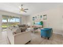 Inviting living room with sliding glass doors and serene views, creating a tranquil atmosphere for relaxation at 1395 Olympic Club Blvd, Champions Gate, FL 33896