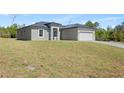 Inviting one-story home featuring a two-car garage and freshly laid lawn at 16753 Sw 29Th Terrace, Ocala, FL 34473