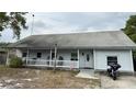 Inviting single-story home with a classic front porch, ideal for relaxing outdoors at 191 Caldwell St, Apopka, FL 32712