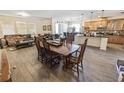 Open-concept dining and living areas with tile flooring and plenty of natural light at 212 Lugano Way, Debary, FL 32713
