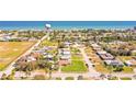 Expansive aerial view showcasing the home's proximity to the beach and surrounding residential neighborhood at 2811 S Peninsula Dr, Daytona Beach, FL 32118