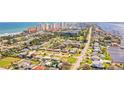 Beautiful aerial view capturing the home's location near the beach, Intracoastal Waterway, and city skyline at 2811 S Peninsula Dr, Daytona Beach, FL 32118
