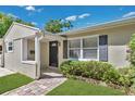 Inviting front entrance with a brick walkway and manicured greenery, showcasing the home's curb appeal at 3000 Amherst Ave, Orlando, FL 32804