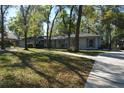 Charming single-story home with well-maintained landscaping, mature trees, and an inviting driveway at 308 Tangerine St, Altamonte Springs, FL 32701