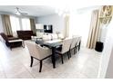 Spacious open-concept living and dining area with ample natural light and stylish modern decor at 4687 Fairy Tale Cir, Kissimmee, FL 34746