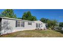 A quaint single-story home with charming curb appeal and well-maintained landscaping, creating a welcoming atmosphere at 6222 Dovecrest Trl, Lakeland, FL 33810