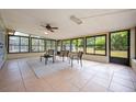 Bright sun room with tile flooring and windows overlooking the backyard at 870 Darwin Dr, Altamonte Springs, FL 32701