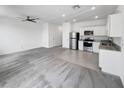Spacious open concept living area with stainless steel appliances and lots of natural light at 1112 Merrill St, Davenport, FL 33837