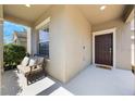 Inviting front porch features a cozy seating area, perfect for enjoying the outdoors at 1155 Seburn Rd, Apopka, FL 32703