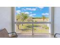 Inviting balcony space with scenic views of the lush green landscape, perfect for relaxing outdoors at 1598 Heritage Crossing Ct # 302, Reunion, FL 34747