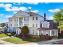 Attractive building boasting classic architectural details, surrounded by lush greenery and manicured lawns at 1598 Heritage Crossing Ct # 302, Reunion, FL 34747