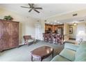 Cozy living area featuring an open layout, comfortable seating, and adjacent kitchen with bar seating at 1598 Heritage Crossing Ct # 302, Reunion, FL 34747