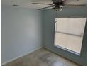 Bedroom with tile floors and a window providing natural light at 214 Magellan Dr, Kissimmee, FL 34758