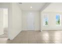 Bright and spacious living room featuring neutral paint and tile floors at 3002 Voyager Ave, St Cloud, FL 34771