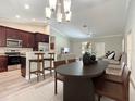 Inviting living space connecting kitchen, dining, and lounge with stylish decor at 509 Mulberry St, Fruitland Park, FL 34731
