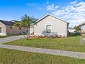 Clean curb appeal with an arched window detail at 2520 Chatham Cir, Kissimmee, FL 34746