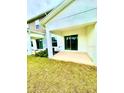 Covered patio area features a sliding glass door, perfect for outdoor relaxation at 2834 Narcoossee Commons Way, St Cloud, FL 34771