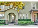 Inviting front entrance featuring an arched doorway and meticulously maintained landscaping at 6218 Forsythe Loop, Sanford, FL 32771