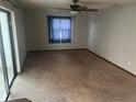 Spacious living room with neutral carpet, providing a comfortable and inviting atmosphere at 947 N Atmore Cir, Deltona, FL 32725