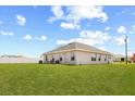 Expansive backyard with lush green lawn perfect for outdoor activities and enjoying the beautiful weather at 2257 Pecos Ct, Kissimmee, FL 34759