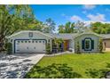 Inviting single-story home featuring a well-manicured lawn and a spacious two car garage at 878 W Timberland Trl, Altamonte Springs, FL 32714