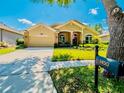 Lovely single-story home with a well-manicured lawn, two-car garage, and welcoming curb appeal at 1450 Chessington Cir, Lake Mary, FL 32746