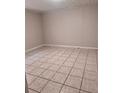 Cozy bedroom with tiled flooring, creating a minimalist and comfortable space at 625 Citrus St, Orlando, FL 32805