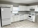 Bright kitchen with white appliances and cabinets, offering a clean and modern feel at 625 Citrus St, Orlando, FL 32805