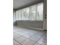 Neutral living room featuring large windows, providing natural light and a serene view at 625 Citrus St, Orlando, FL 32805