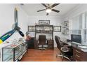 Cozy office with stylish decor, hardwood floors, and ample storage space at 720 Basin Dr, Kissimmee, FL 34744