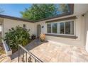 Inviting entrance with stone tile and brown trim, leading into a light and airy home at 769 Little Wekiva Cir, Altamonte Springs, FL 32714