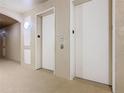 Two clean, accessible elevators with clear floor markings, ensuring convenient building access at 2781 Almaton Loop # 203, Kissimmee, FL 34747