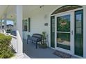 Inviting front entrance featuring a stylish door with glass, a 'Welcome' mat, and a cozy seating area at 4240 Lake Harney Cir, Geneva, FL 32732