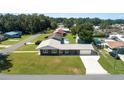Aerial view showcases this charming home, nicely landscaped lawn, and proximity to the surrounding neighborhood at 5134 Harvard W St, Lakeland, FL 33810