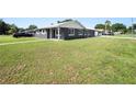 This beautifully landscaped home features ample yard space, a charming exterior, and updated windows at 5134 Harvard W St, Lakeland, FL 33810