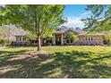 Charming stone-accented home with manicured lawn and mature landscaping at 5200 Carson St, St Cloud, FL 34771