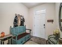 Cozy entryway with a bench, coat rack, and decorative touches at 5367 Pinecone Ct, Wildwood, FL 34785