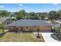 Inviting single-story home with large backyard and a spacious two-car garage with ample sunlight at 8720 Larwin Ln, Orlando, FL 32817