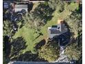 Aerial view showcasing the property's layout, landscaping, and surrounding neighborhood at 4570 Chambliss Rd, Winter Haven, FL 33884