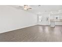 Spacious living room features hard surface flooring and lots of natural light at 836 Poppy Ln, Dundee, FL 33838