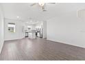 Spacious living area featuring a kitchen, recessed lighting, and natural light at 848 Poppy Ln, Dundee, FL 33838