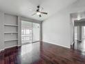 Bedroom with a sliding glass door to a balcony and hardwood floors at 2615 Maitland Crossing Way # 9 307, Orlando, FL 32810