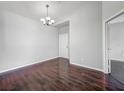 Open-plan dining room featuring hardwood floors, chandelier, and lots of natural light at 2615 Maitland Crossing Way # 9 307, Orlando, FL 32810